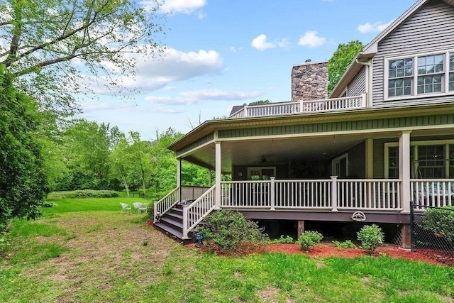 311 River Rd, South Hadley, MA 01075 - back of house featuring a chimney, covered porch, and a yard