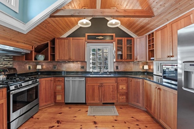 kitchen featuring exhaust hood, stainless steel appliances, open shelves, and a sink
