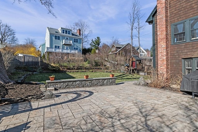 view of patio / terrace featuring fence