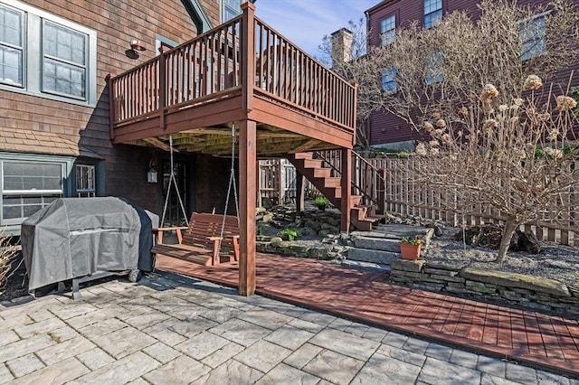 view of patio with a deck, stairway, and grilling area