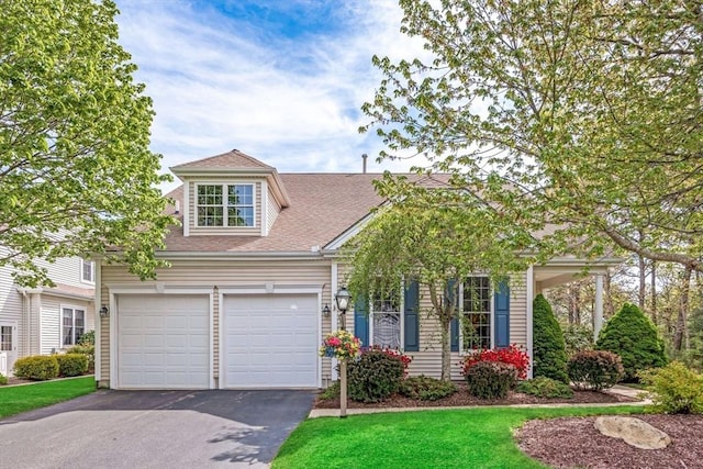 40 Canoe Lndg, Plymouth, MA 02360 - view of front of home featuring asphalt driveway, a shingled roof, and a front lawn