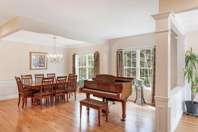 40 Canoe Lndg, Plymouth, MA 02360 - sitting room featuring light wood-style floors, a chandelier, a decorative wall, ornate columns, and ornamental molding
