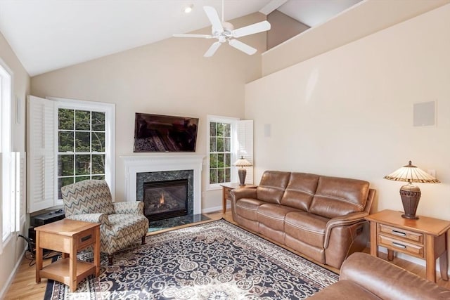40 Canoe Lndg, Plymouth, MA 02360 - living area featuring ceiling fan, wood finished floors, a premium fireplace, high vaulted ceiling, and baseboards