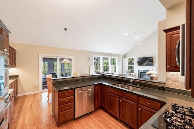 40 Canoe Lndg, Plymouth, MA 02360 - kitchen featuring stainless steel dishwasher, a sink, black gas cooktop, ceiling fan, and light wood-style floors
