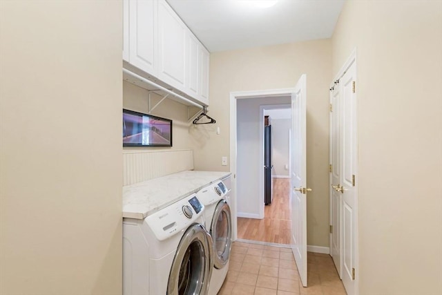 40 Canoe Lndg, Plymouth, MA 02360 - laundry room with cabinet space, separate washer and dryer, light tile patterned floors, and baseboards