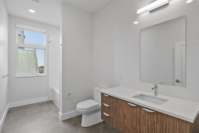 full bathroom with vanity, toilet, washtub / shower combination, and baseboards