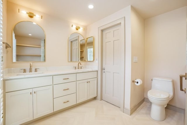 25 Hopewell Farm Rd Unit 25, Natick, MA 01760 - bathroom featuring double vanity, toilet, recessed lighting, and baseboards