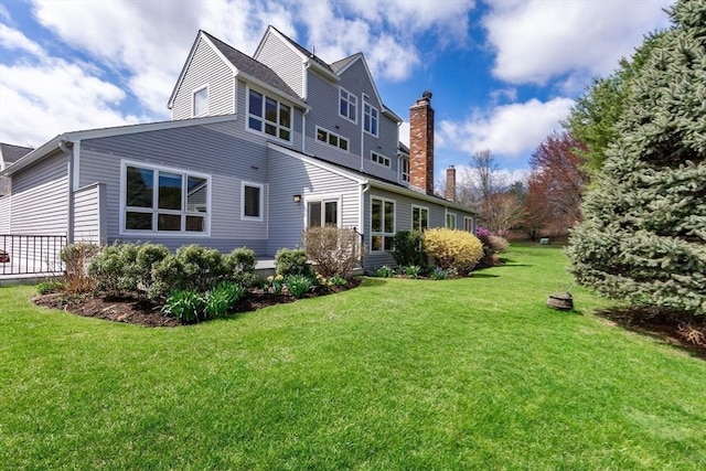 25 Hopewell Farm Rd Unit 25, Natick, MA 01760 - back of property with a chimney and a yard