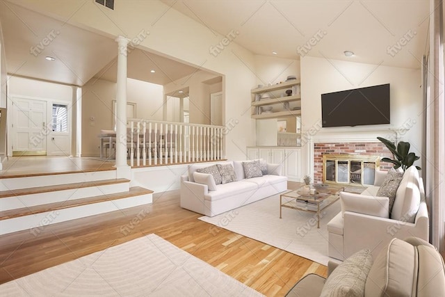 25 Hopewell Farm Rd Unit 25, Natick, MA 01760 - living area with wood finished floors, ornate columns, and lofted ceiling