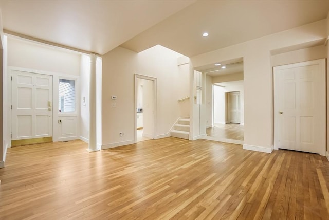 25 Hopewell Farm Rd Unit 25, Natick, MA 01760 - unfurnished living room with light wood-type flooring, baseboards, ornate columns, and recessed lighting