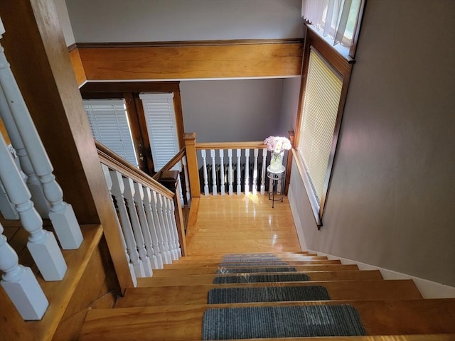 stairway featuring wood finished floors