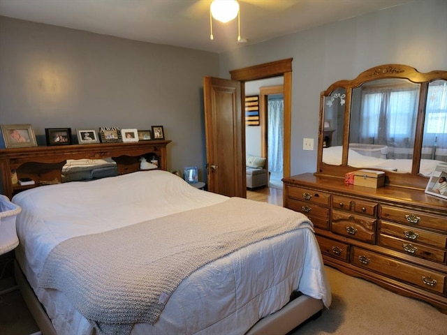 bedroom with light colored carpet and ceiling fan