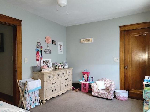 bedroom with a ceiling fan and carpet