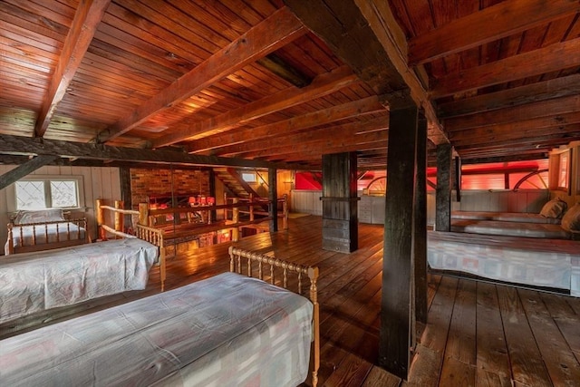 192 W Main St, Westborough, MA 01581 - unfurnished bedroom featuring beam ceiling, wood walls, wooden ceiling, and hardwood / wood-style floors