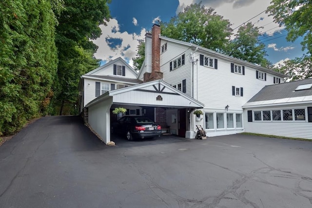 192 W Main St, Westborough, MA 01581 - exterior space with driveway and a chimney