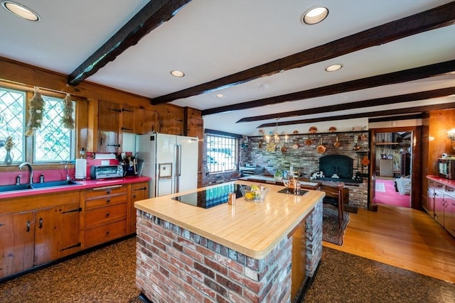 192 W Main St, Westborough, MA 01581 - kitchen with butcher block counters, brown cabinets, white fridge with ice dispenser, and a sink