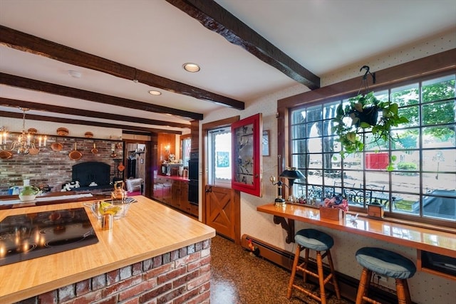 192 W Main St, Westborough, MA 01581 - kitchen with black electric stovetop, beamed ceiling, butcher block counters, a notable chandelier, and a baseboard radiator