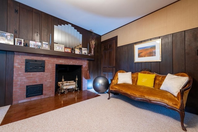 192 W Main St, Westborough, MA 01581 - living area with carpet floors, wood walls, and a fireplace