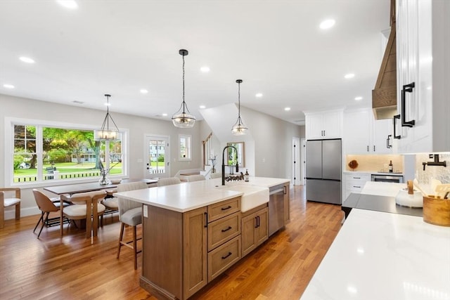 28 Marlboro Rd, Woburn, MA 01801 - kitchen featuring stainless steel appliances, a sink, healthy amount of natural light, light countertops, and recessed lighting