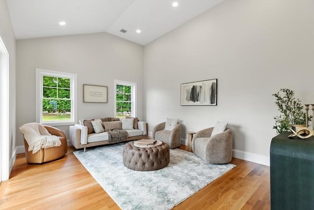 28 Marlboro Rd, Woburn, MA 01801 - living room with light wood-type flooring, baseboards, recessed lighting, and high vaulted ceiling
