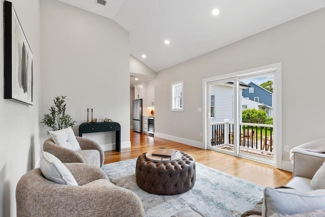 28 Marlboro Rd, Woburn, MA 01801 - living area featuring light wood-style floors, recessed lighting, baseboards, and high vaulted ceiling