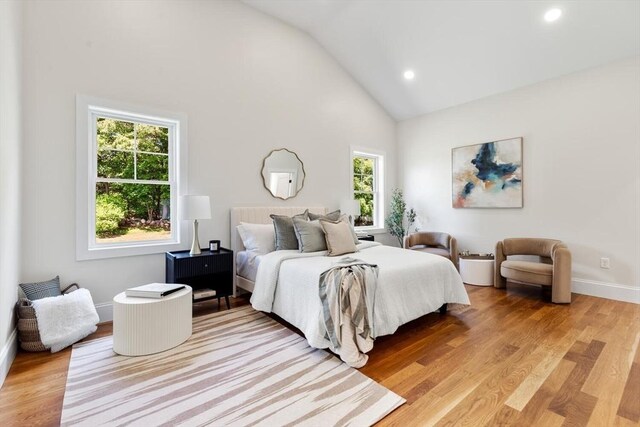 28 Marlboro Rd, Woburn, MA 01801 - bedroom with light wood-style flooring, high vaulted ceiling, recessed lighting, and baseboards