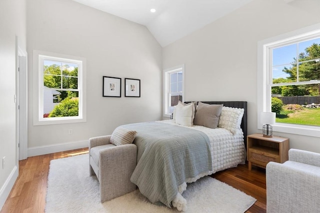 28 Marlboro Rd, Woburn, MA 01801 - bedroom featuring multiple windows, lofted ceiling, wood finished floors, and baseboards