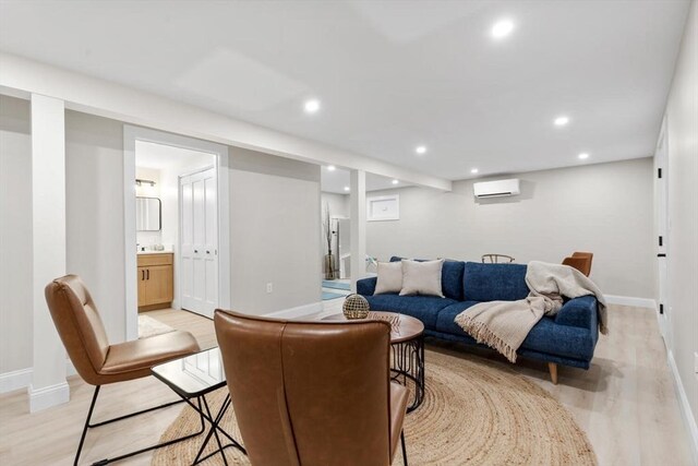 28 Marlboro Rd, Woburn, MA 01801 - living room featuring a wall mounted AC, baseboards, light wood-type flooring, and recessed lighting