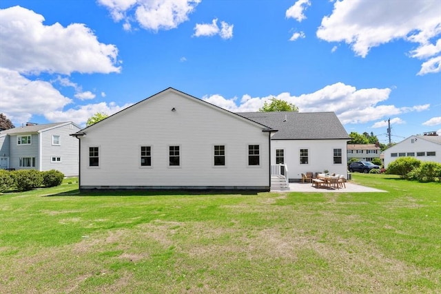 28 Marlboro Rd, Woburn, MA 01801 - rear view of house featuring a patio area, a lawn, and entry steps
