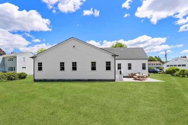 28 Marlboro Rd, Woburn, MA 01801 - rear view of property with a patio area, a lawn, and entry steps