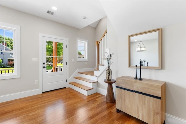 28 Marlboro Rd, Woburn, MA 01801 - foyer entrance with light wood-style floors, stairway, baseboards, and recessed lighting