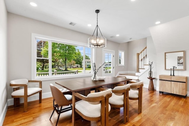 28 Marlboro Rd, Woburn, MA 01801 - dining area featuring a chandelier, light wood finished floors, baseboards, recessed lighting, and stairs