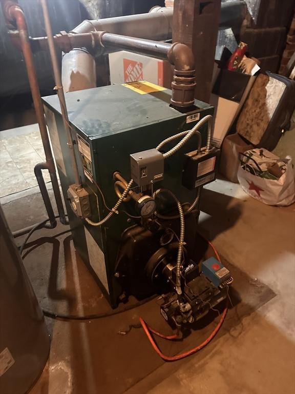 24 Main St, Monson, MA 01057 - utility room featuring a heating unit