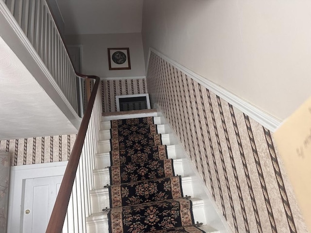 24 Main St, Monson, MA 01057 - staircase featuring wallpapered walls and wainscoting