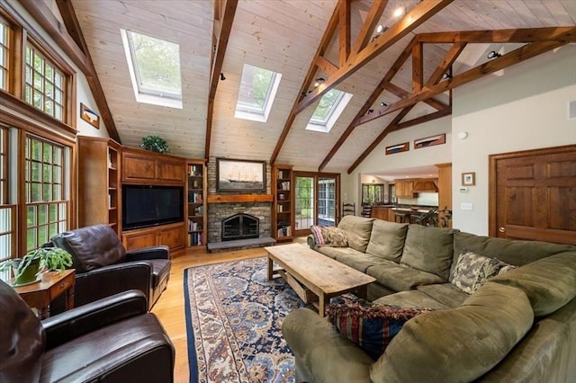 94 Middleton Rd, Boxford, MA 01921 - living room with high vaulted ceiling, light wood-style flooring, beam ceiling, a skylight, and wood ceiling
