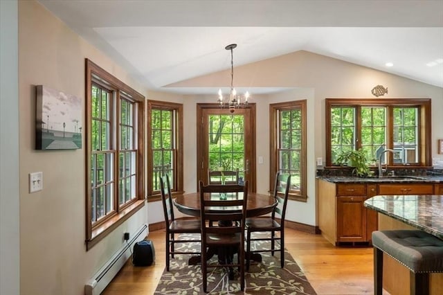 94 Middleton Rd, Boxford, MA 01921 - dining area with lofted ceiling, a baseboard heating unit, light wood-type flooring, baseboards, and a chandelier
