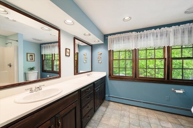 94 Middleton Rd, Boxford, MA 01921 - bathroom with a baseboard radiator, double vanity, recessed lighting, toilet, and a shower