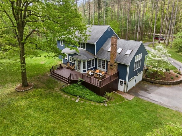 94 Middleton Rd, Boxford, MA 01921 - back of house featuring a deck, asphalt driveway, a chimney, a garage, and a shingled roof