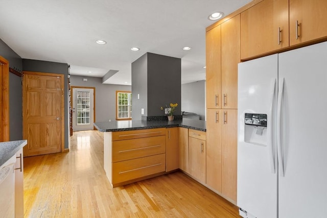 4 Hadwen Rd, Worcester, MA 01602 - kitchen featuring white appliances, a peninsula, light wood-style floors, recessed lighting, and dark stone counters