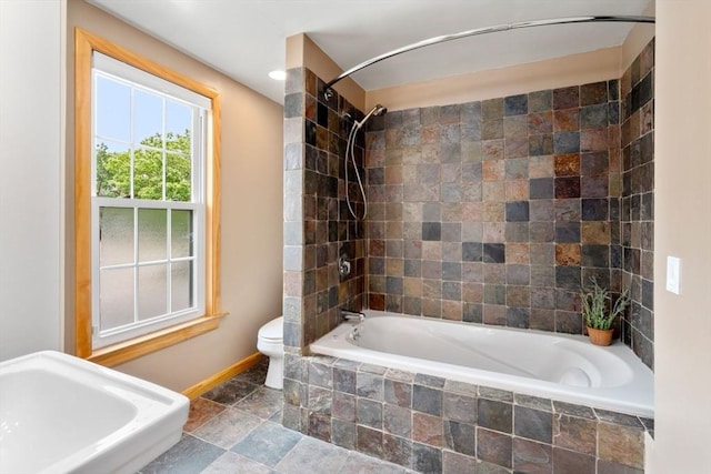 4 Hadwen Rd, Worcester, MA 01602 - bathroom featuring baseboards, tiled shower / bath combo, and toilet