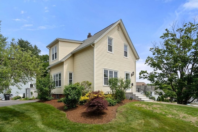 4 Hadwen Rd, Worcester, MA 01602 - view of home's exterior featuring a yard and a chimney