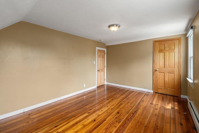 4 Hadwen Rd, Worcester, MA 01602 - unfurnished room with a baseboard heating unit, hardwood / wood-style floors, baseboards, and lofted ceiling