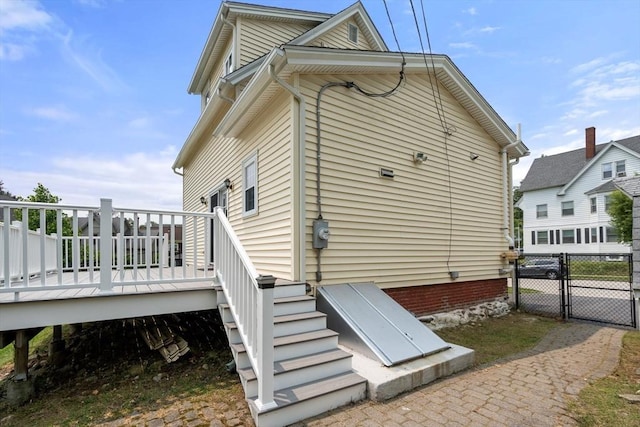 4 Hadwen Rd, Worcester, MA 01602 - view of side of home with a wooden deck and a gate