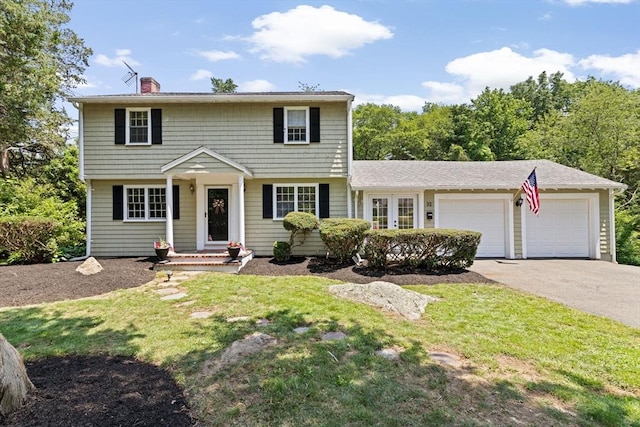 32 Gannett Pasture Ln, Scituate, MA 02066 - colonial home featuring asphalt driveway, a garage, a chimney, and a front yard