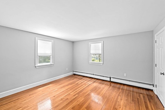 32 Gannett Pasture Ln, Scituate, MA 02066 - empty room with baseboard heating and wood finished floors