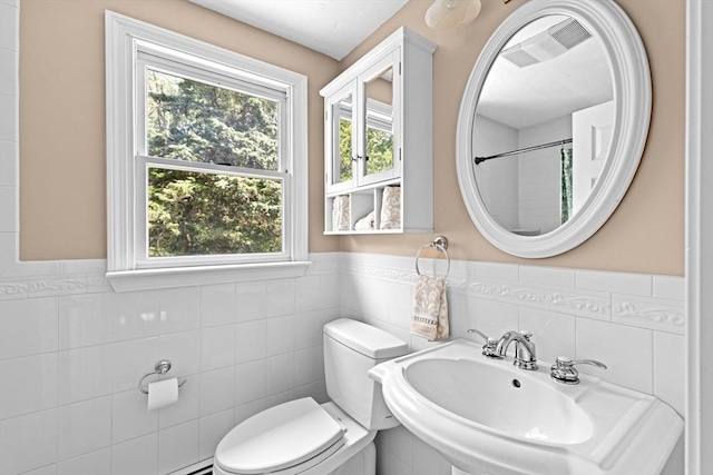 32 Gannett Pasture Ln, Scituate, MA 02066 - bathroom with tile walls, wainscoting, and curtained shower
