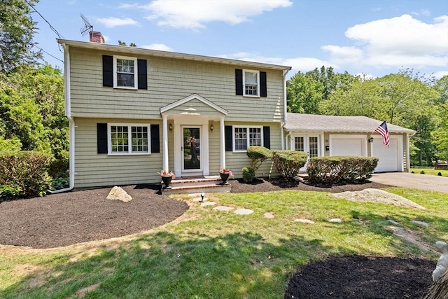 32 Gannett Pasture Ln, Scituate, MA 02066 - colonial-style house with a chimney, a garage, driveway, and a front lawn