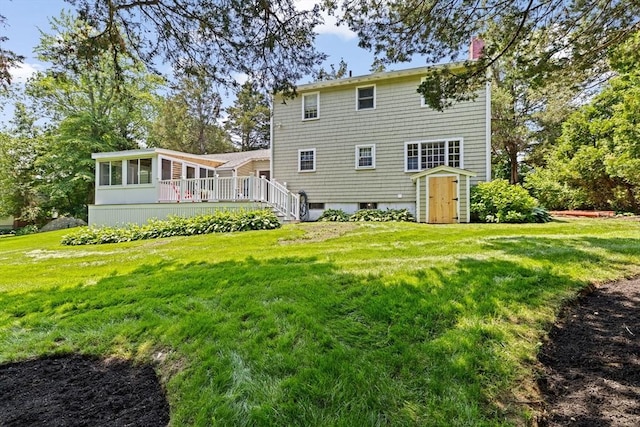 32 Gannett Pasture Ln, Scituate, MA 02066 - rear view of property with a sunroom, a chimney, and a lawn