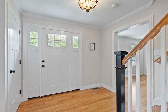 35 Lucaya Cir, Wilmington, MA 01887 - entryway featuring light wood-style floors, healthy amount of natural light, baseboards, and crown molding
