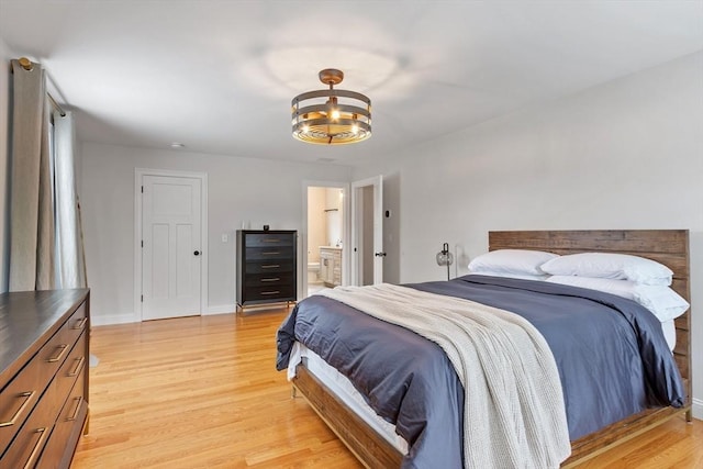 35 Lucaya Cir, Wilmington, MA 01887 - bedroom with light wood-style floors, a chandelier, connected bathroom, and baseboards